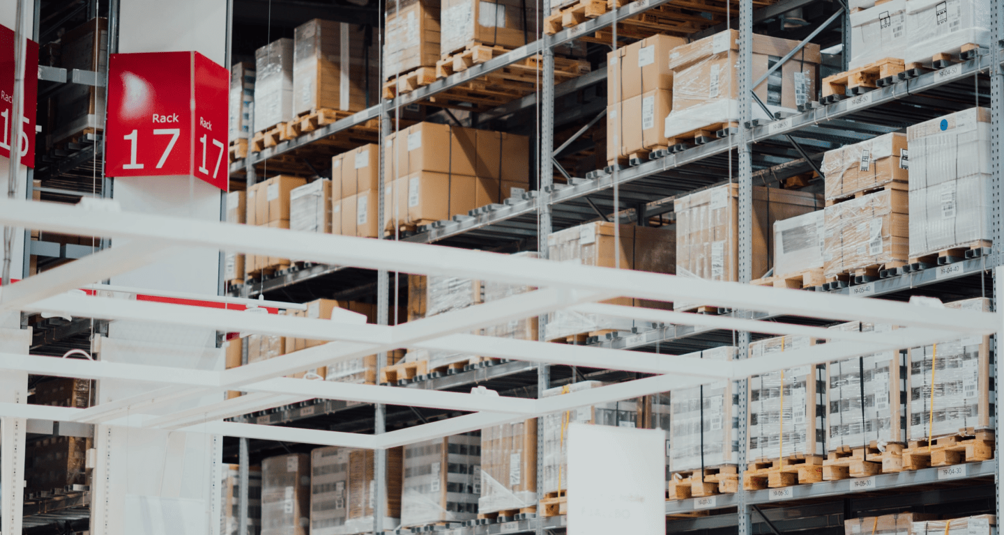 A view of warehouse shelving with boxes and pallets